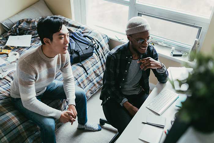 Two roommates in a dorm room
