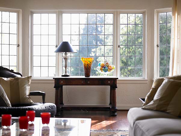 Beautifully decorated living room with large airy windows