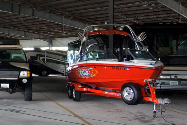A boat and car stored in Price Self Storage Solana Beach CA indoor storage facility