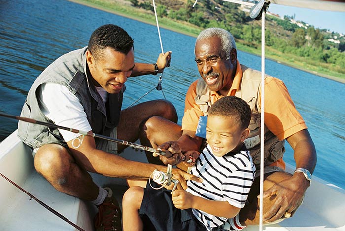 Family fishing off a boat