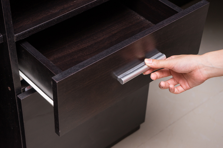 Woman hand open drawer