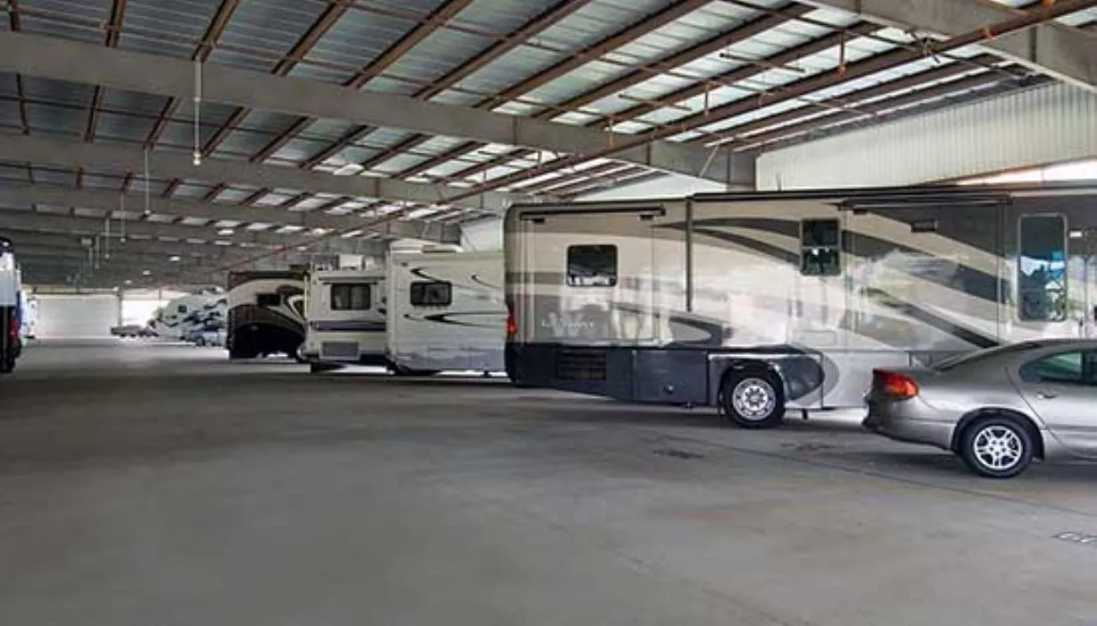 Indoor parking storage facility with motorhomes and other vehicles parked inside