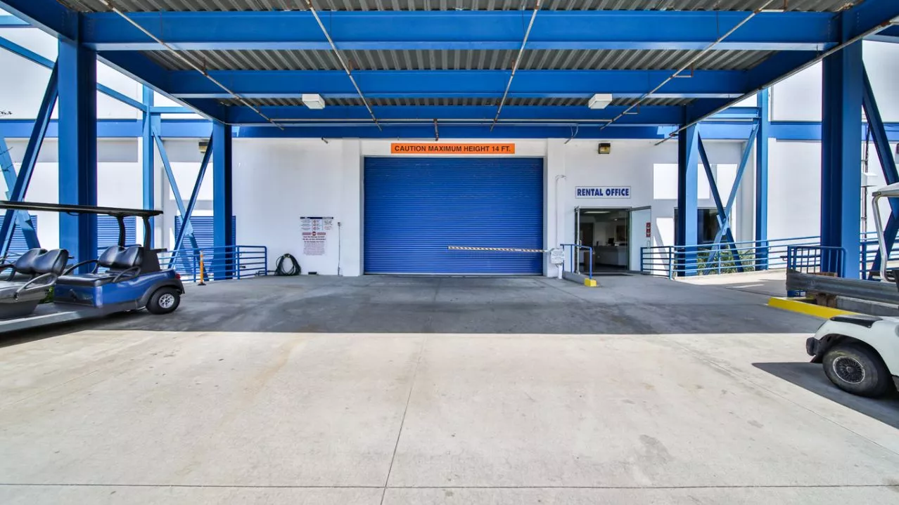 Price Self Storage West Los Angeles La Brea Avenue delivery truck driving through the front entrance to the indoor storage facility