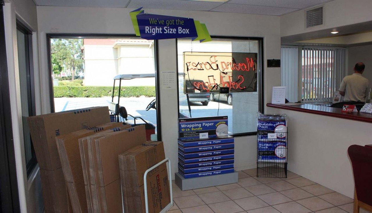 Rental office merchandise display wall with tape, bubble wrap, mattress bags for sale