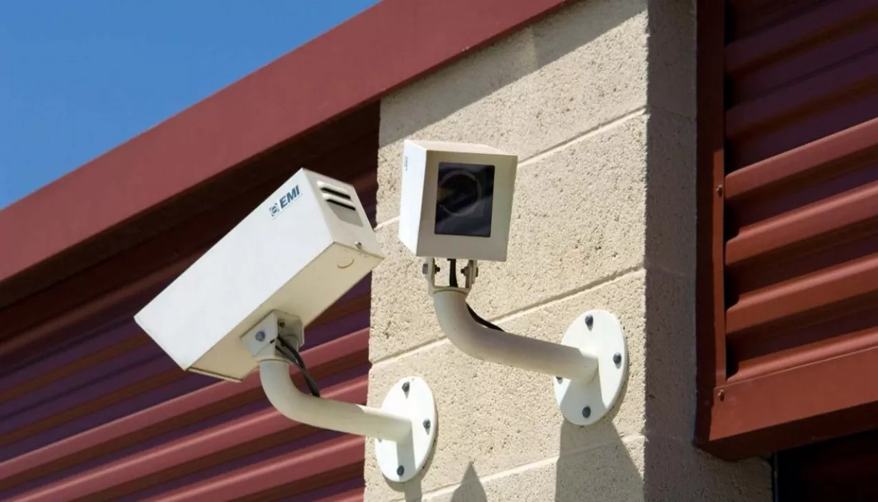 Security camera mounted on building