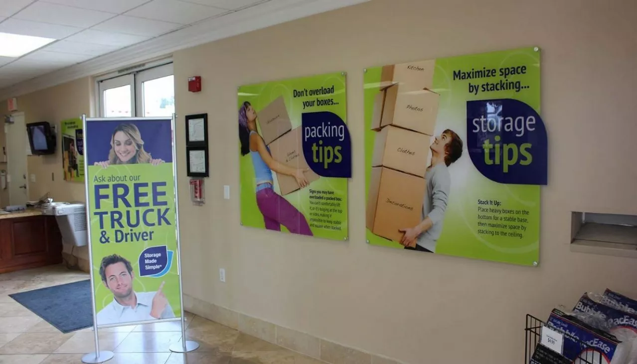 Rental office promotional signs for tips and Free Truck & Driver