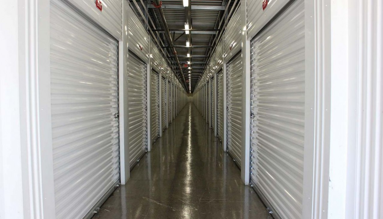 Interior hallway with a variety of storage unit sizes with roll up doors