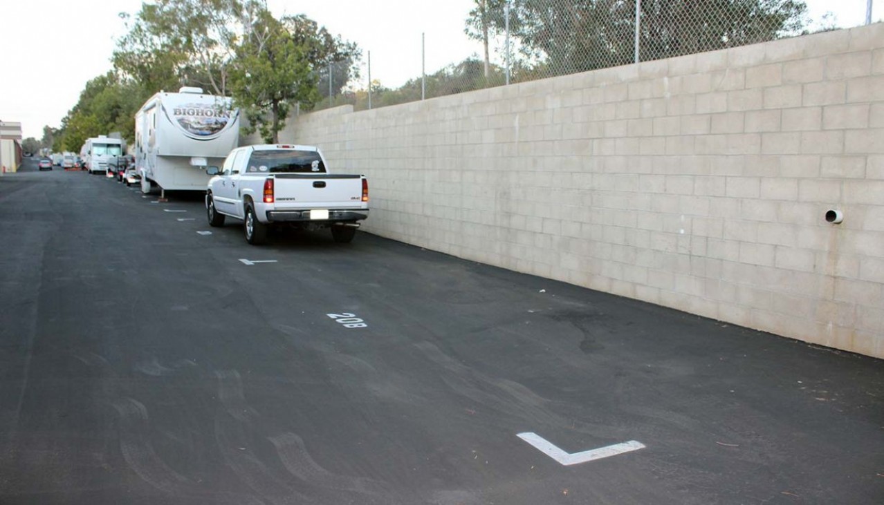 Cars, trucks, RV's parked in vehicle storage spaces