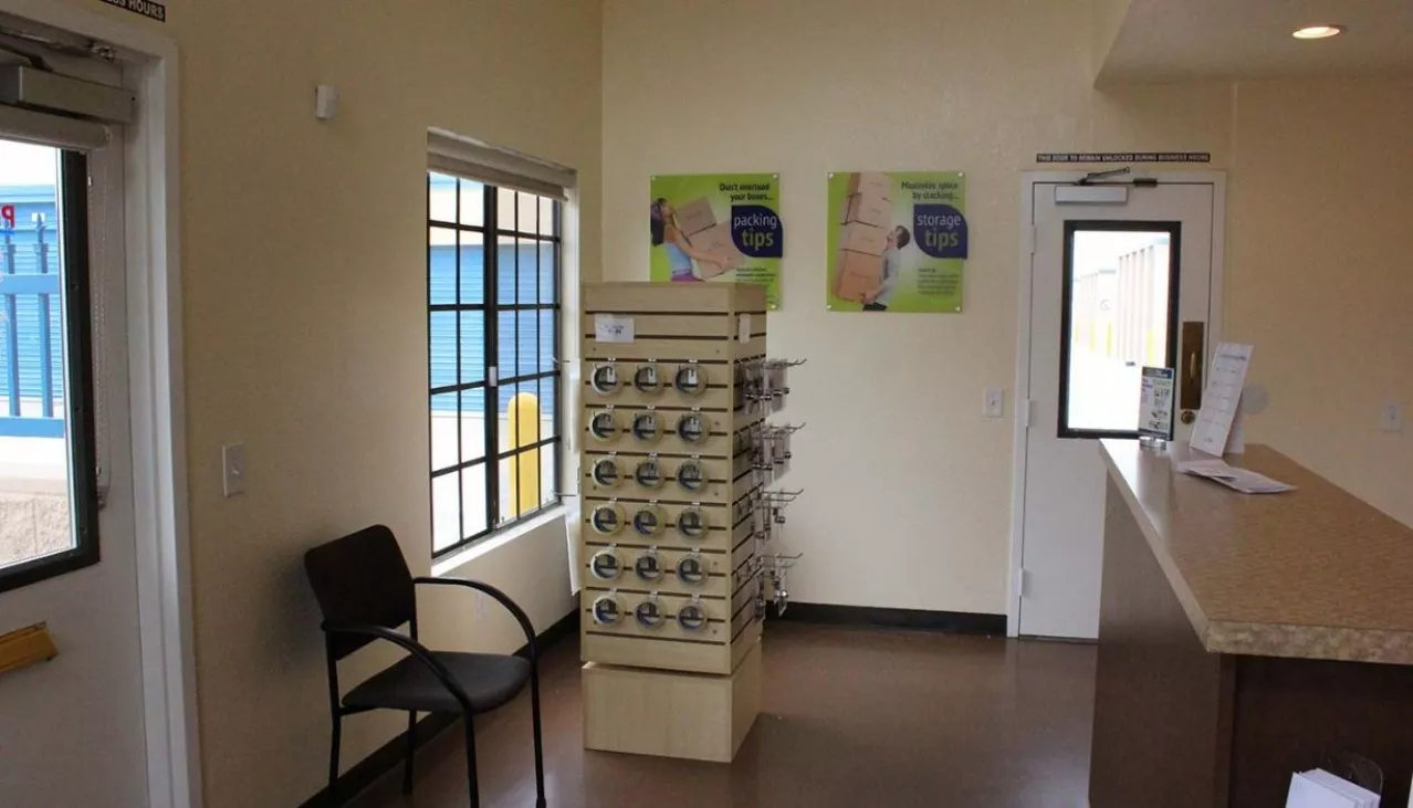 Rental office merchandise display rack of packing tape and supplies for sale