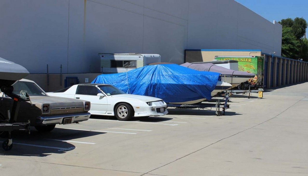 Cars, boats and trailers parked in vehicle storage spaces
