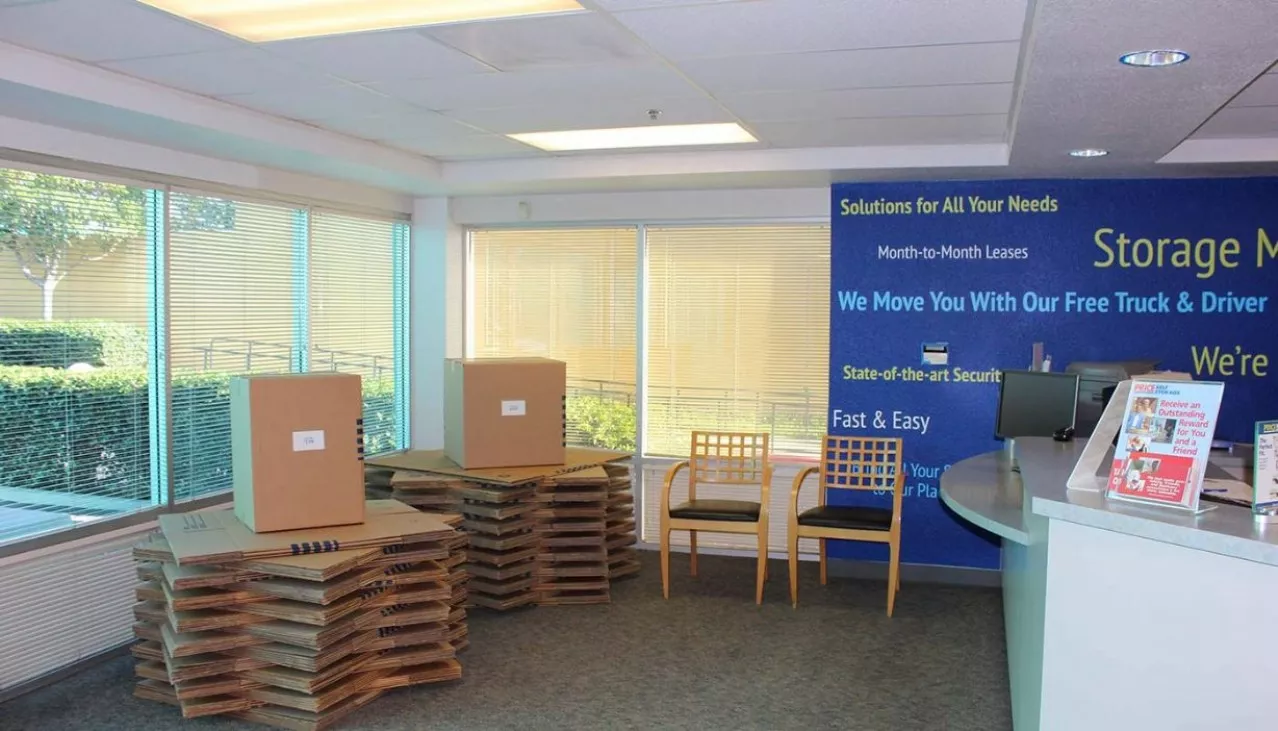 Price Self Storage Pacific Beach rental office with stacked moving boxes for sale on display