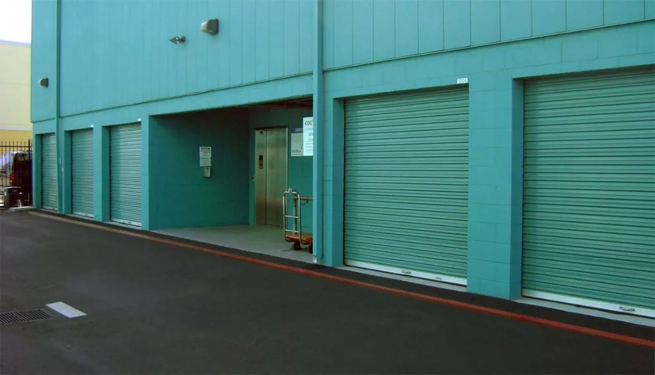 Price Self Storage Pacific Beach drive up units with roll up doors and an easy access elevator to upper levels of the building