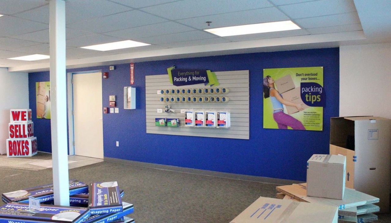 Price Self Storage Pacific Beach rental office and packing and moving supplies merchandise display wall