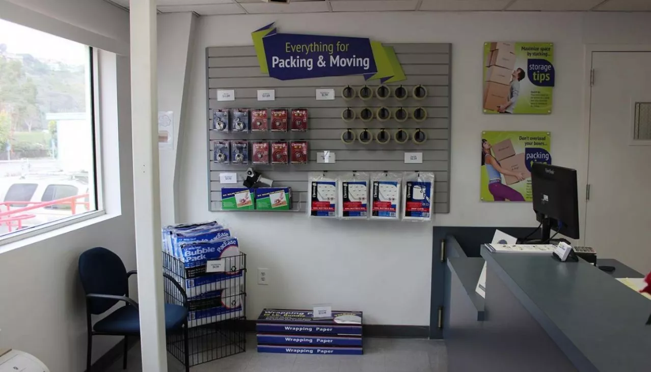 Storage rental office merchandise display wall with packing and moving supplies