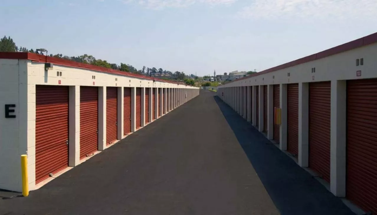 Drive-up self storage unit with aluminum walls and rolled up door