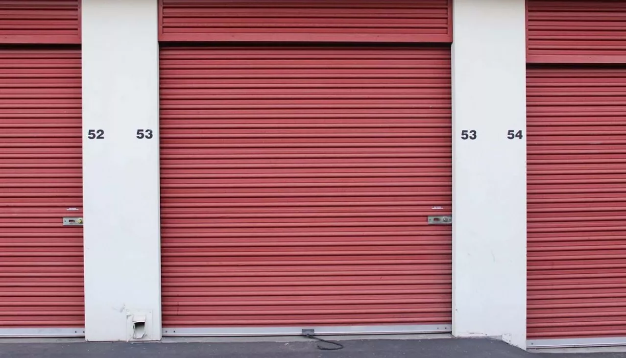 Storage facility interior hallway with rollup doors