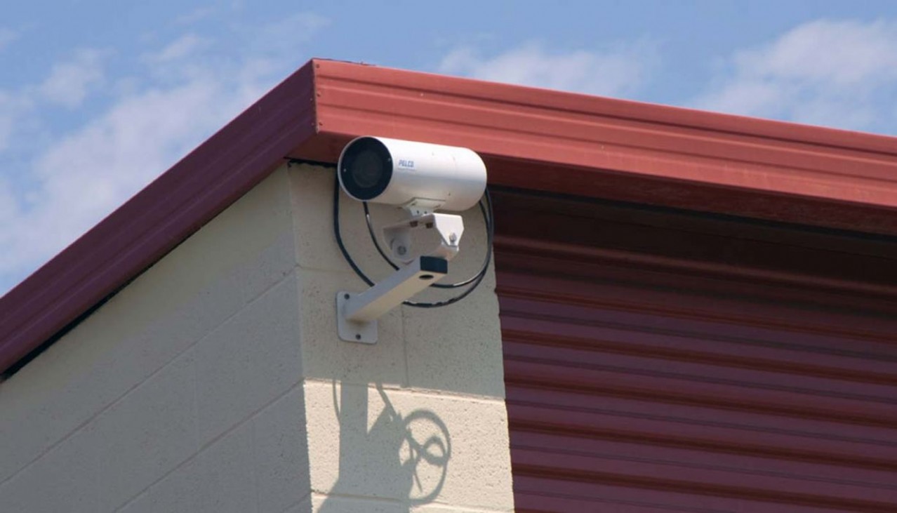 Video security camera mounted on the corner of a building