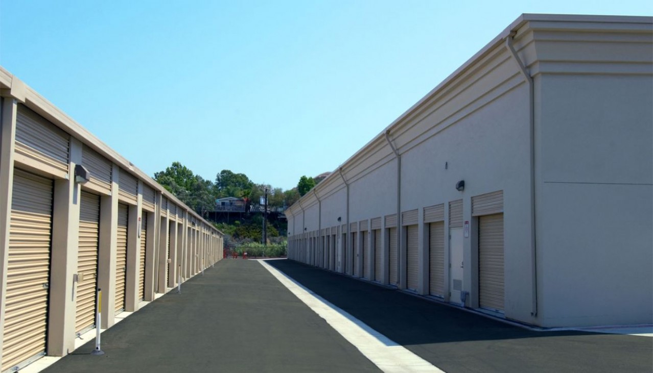 Storage unit hallway with rollup doors on each side