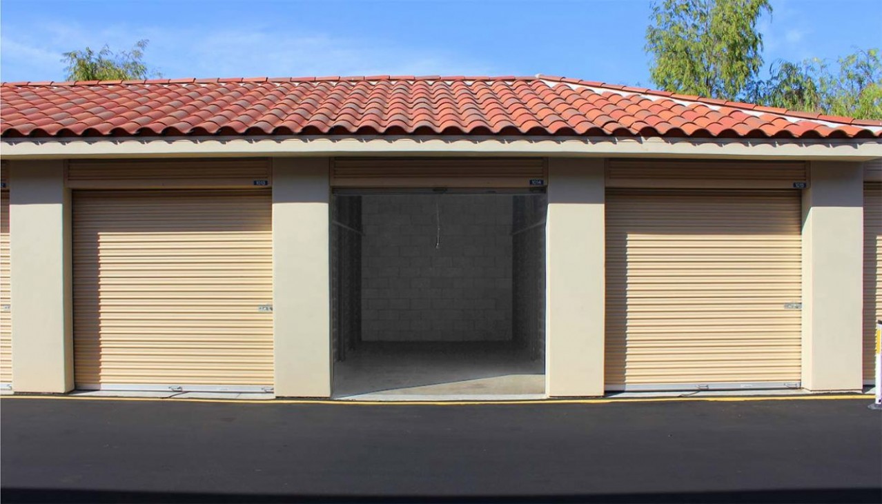 Drive aisle at storage facility with rollup doors and large drive-up units