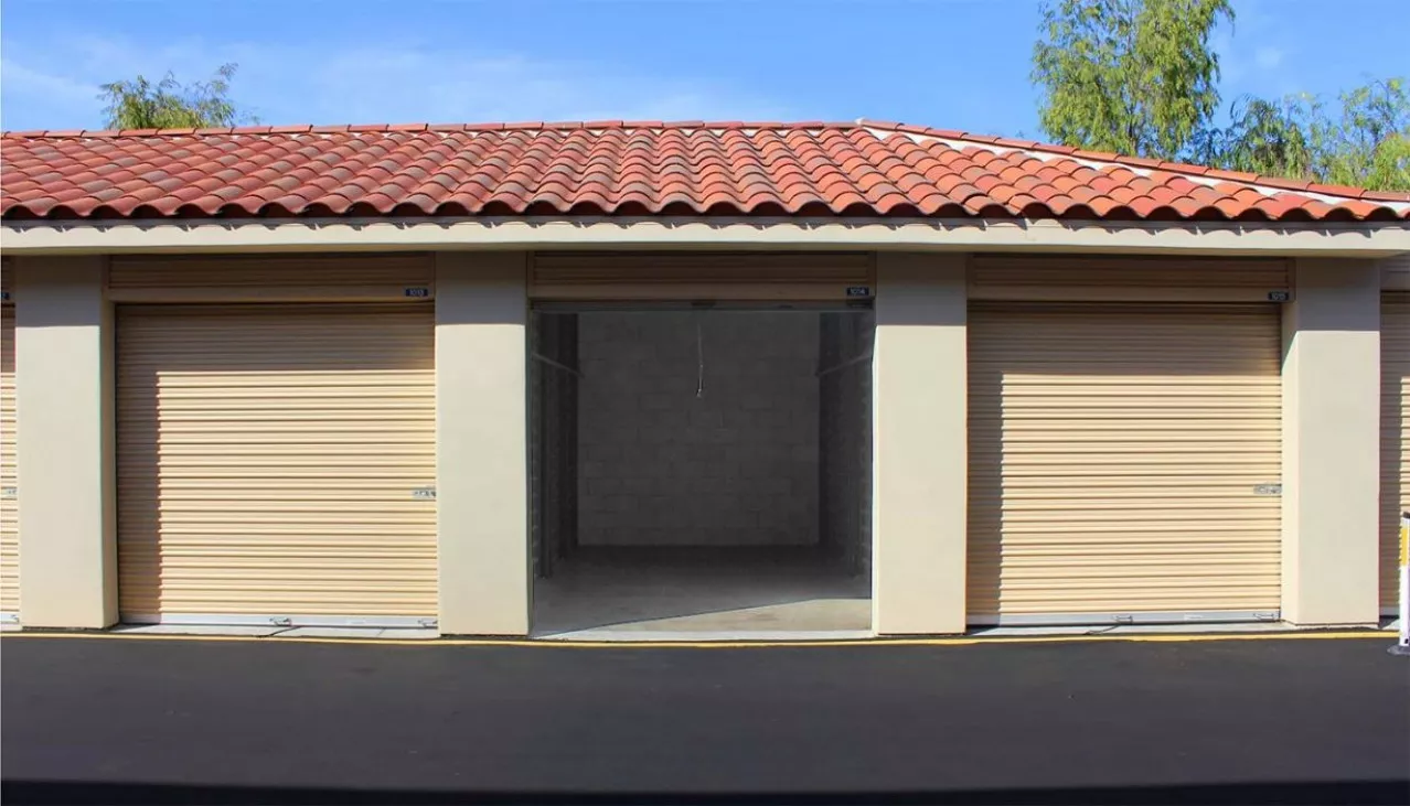 Drive aisle at storage facility with rollup doors and large drive-up units