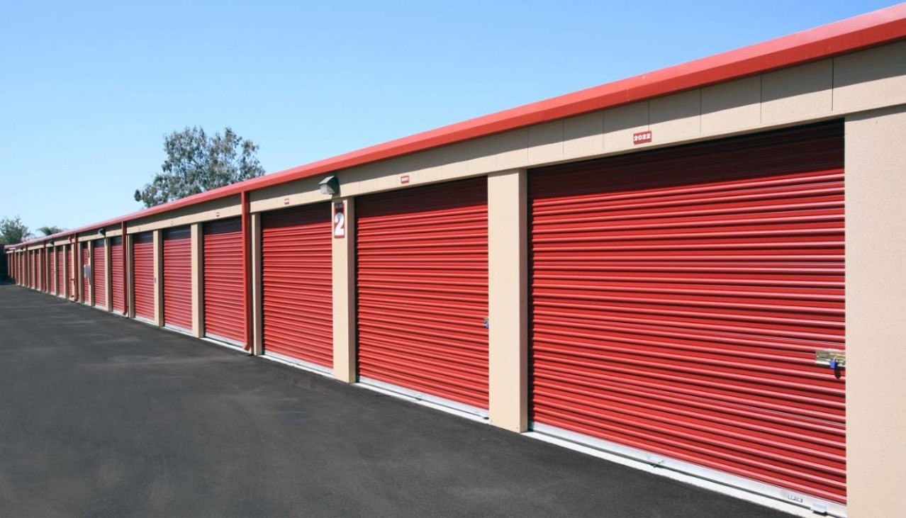 Row of garage sized storage units with rollup doors