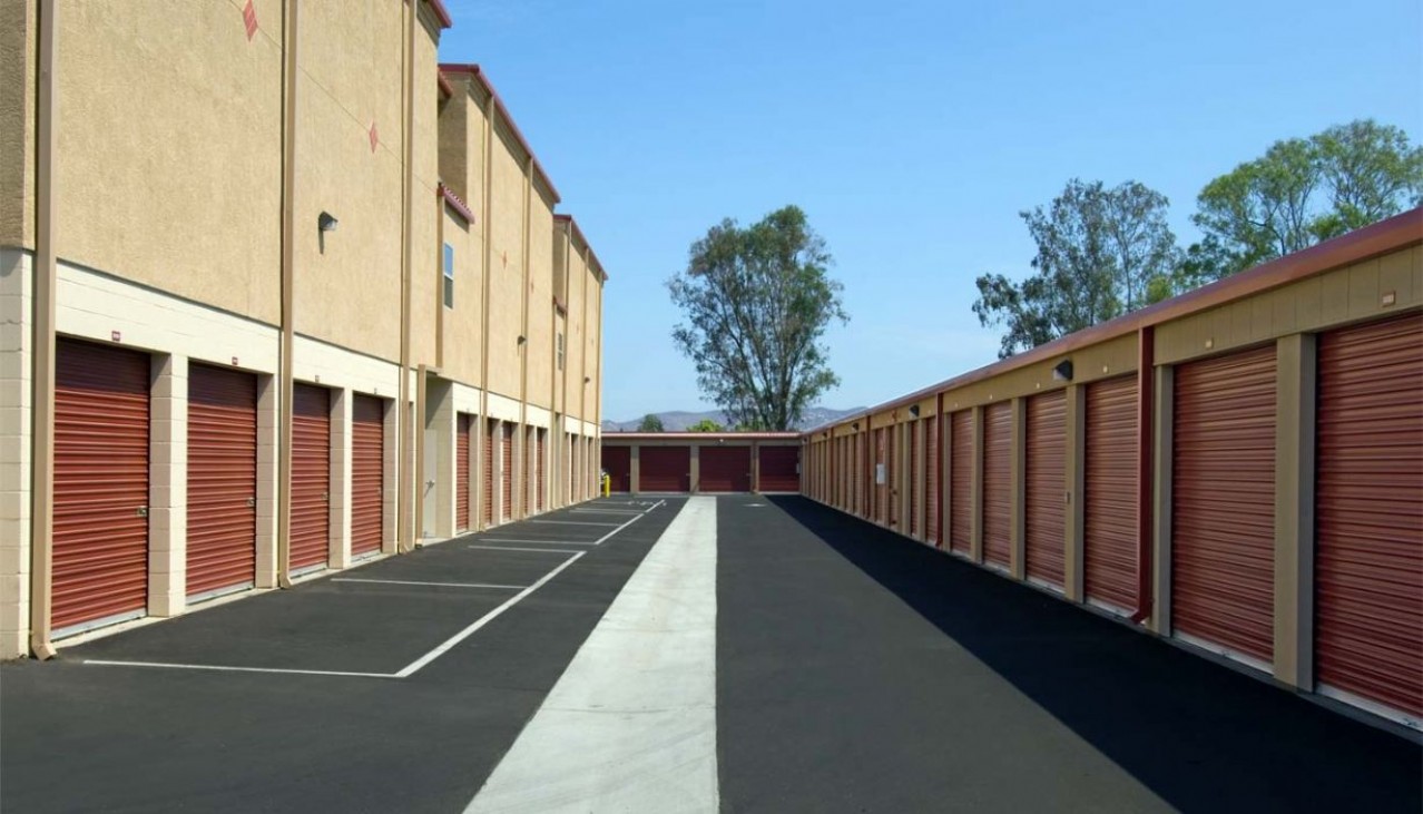 Drive aisle to ground floor large storage units with roll up doors