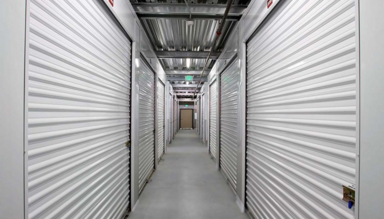 Interior hallway with various sizes of storage units with roll up doors