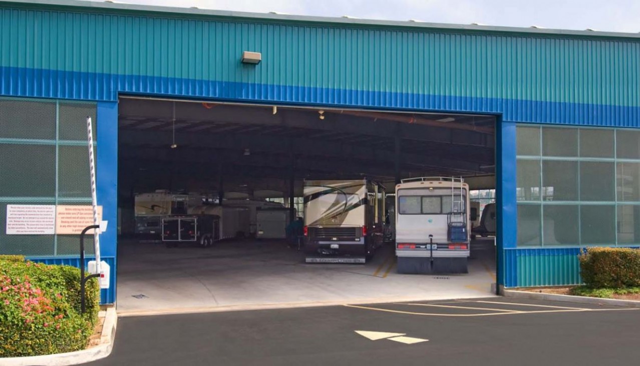 Huge rollup door entrance to indoor RV and vehicle parking building
