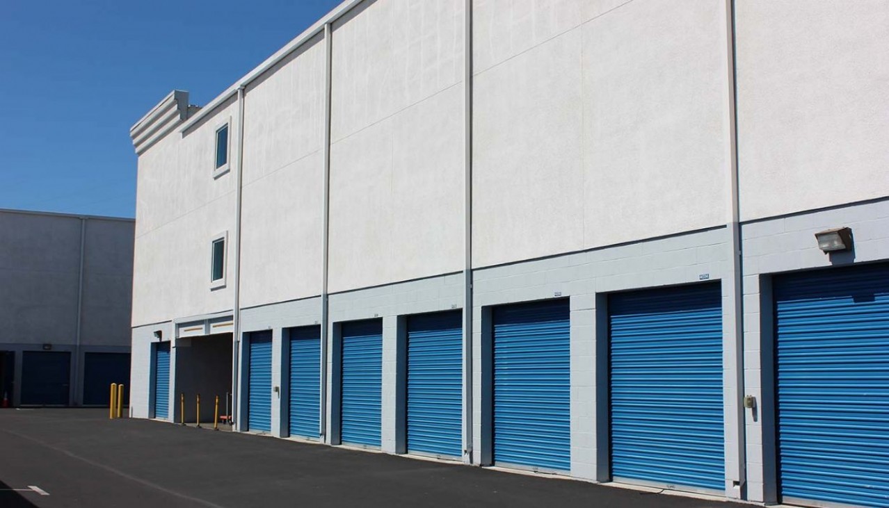 Price Self Storage Walnut Creek interior hallway with many sized storage units with roll up doors