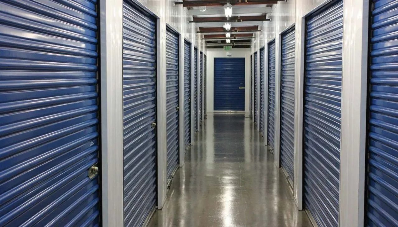 Price Self Storage Walnut Creek interior hallway with large sized storage units with roll up doors