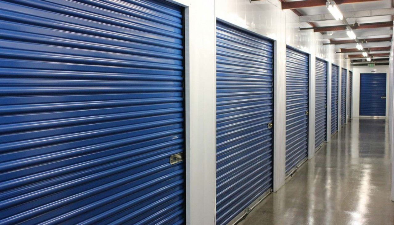 Price Self Storage Walnut Creek interior hallway with various sized storage units with roll up doors