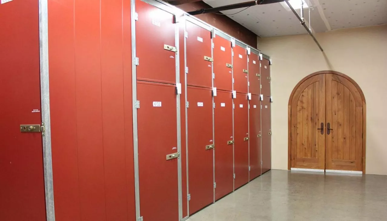 Various size wine storage lockers near wine cellar entrance door