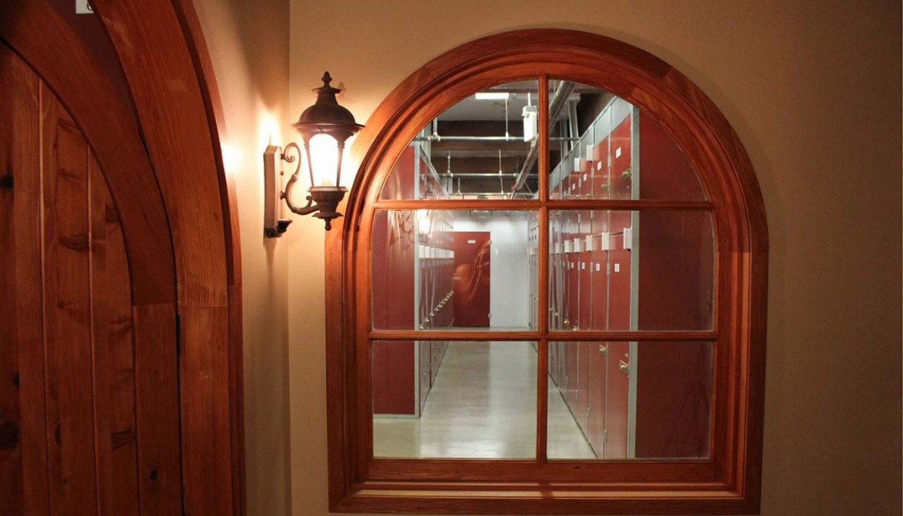 View through paned window of the wine storage area